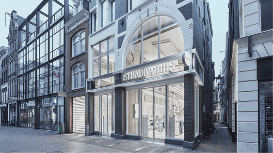 Facade of the Stradivarius store on an urban street with historic and modern buildings.